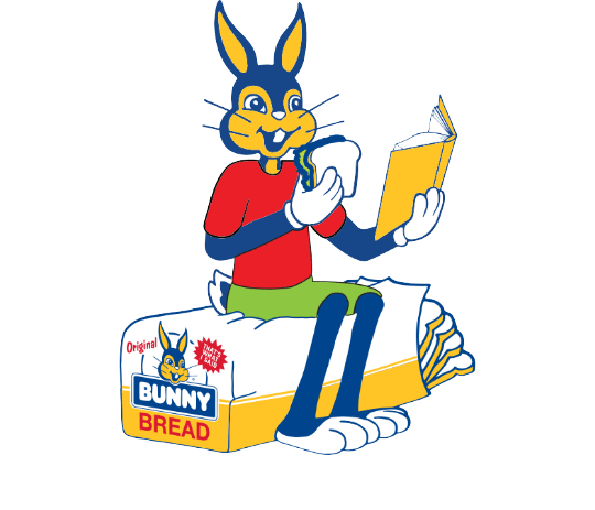 Bunny eating a sandwich and reading a book